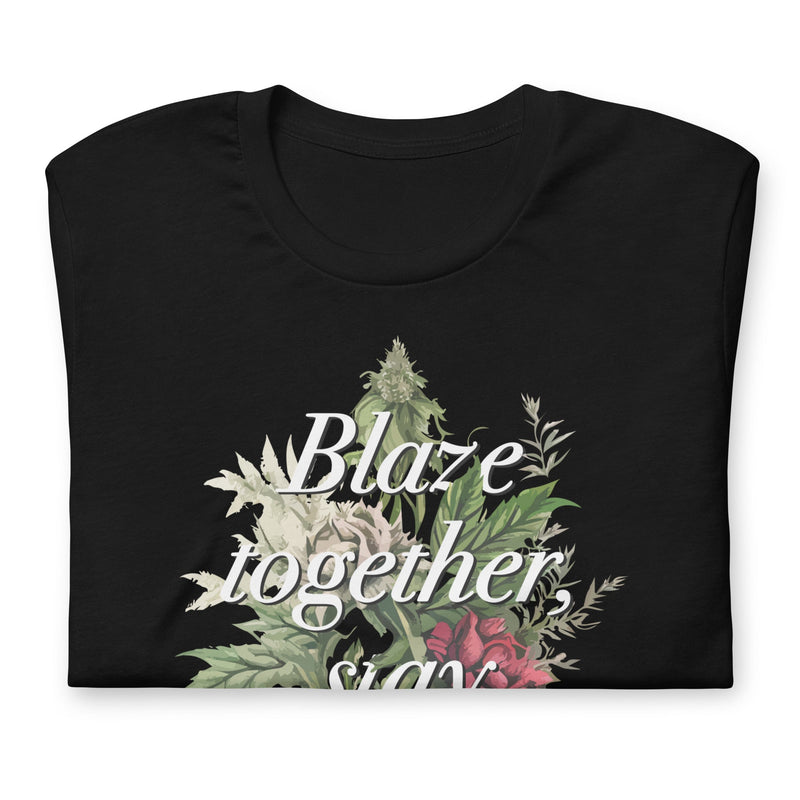 Folded Black t-shirt with "Blaze together, stay together" design featuring floral and cannabis elements.
