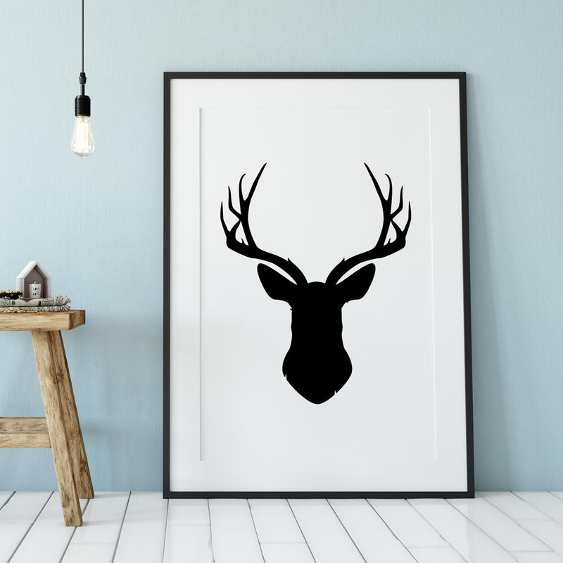 Framed poster featuring a black deer head silhouette on a white background.