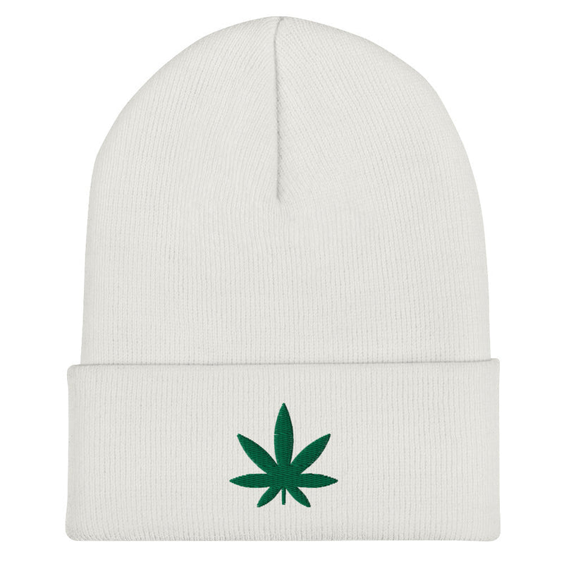 white beanie with an embroidered green cannabis leaf