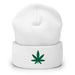 white beanie with an embroidered green cannabis leaf