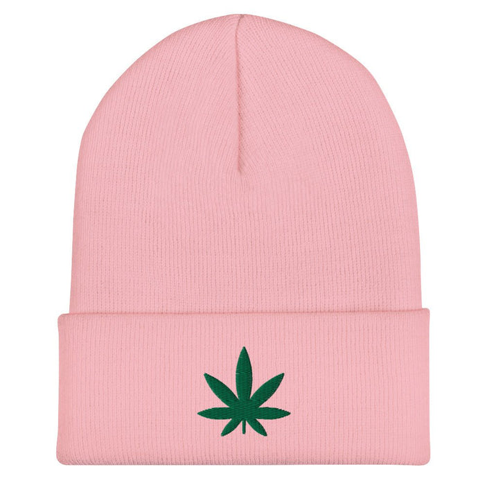 pink beanie with an embroidered green cannabis leaf