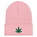pink beanie with an embroidered green cannabis leaf