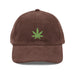Brown Leaf - Vintage Corduroy Caps laid flat on a white background, showcasing the embroidered green cannabis leaf and gold-colored metal buckle.