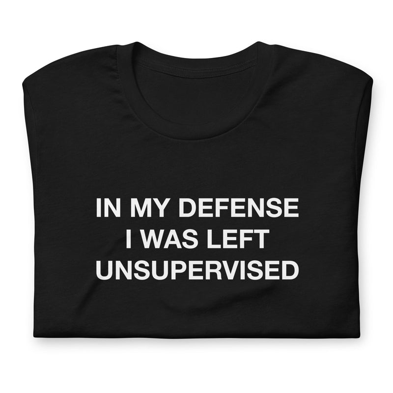 Folded "In my defense, I was left unsupervised" t-shirt available in black, part of the "Funny" collection.