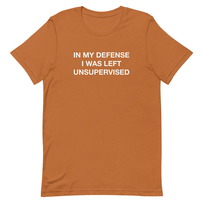 "In my defense, I was left unsupervised" t-shirt available in mustard orange, part of the "Funny" collection.