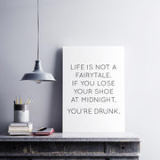Poster with the quote "Life is not a fairytale. If you lose your shoe at midnight, you’re drunk."