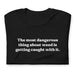Folded Black T-Shirt with the quote "The Most Dangerous Thing About Weed is Getting Caught With It" by Bill Murray