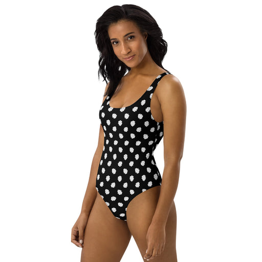 model wearing a black and white cannabis themed polka dot swimsuit
