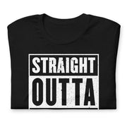 Folded Black t-shirt with bold white text reading “Straight Outta Shape.”