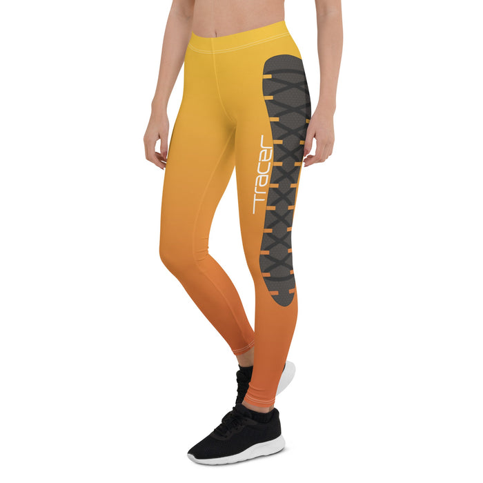 woman modeling Leggings designed to resemble the original skin of the Overwatch character, Tracer.